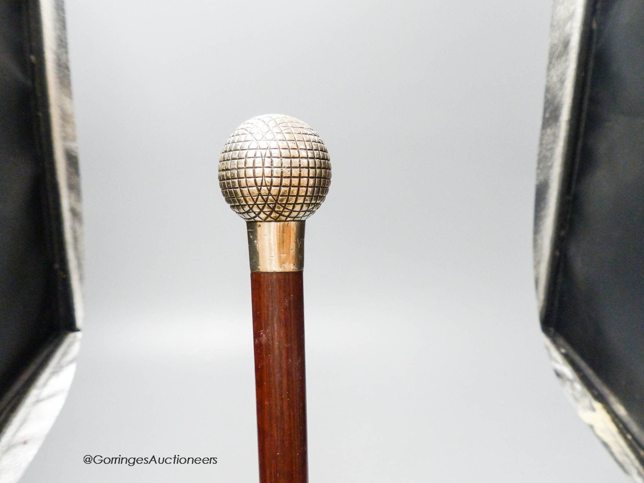 A Briggs silver topped 'golf ball' walking cane, London 1913